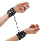 KINK – Handgelenksfesseln mit Druckverschluss, voller Nieten, 19–24 cm x 5,5 cm