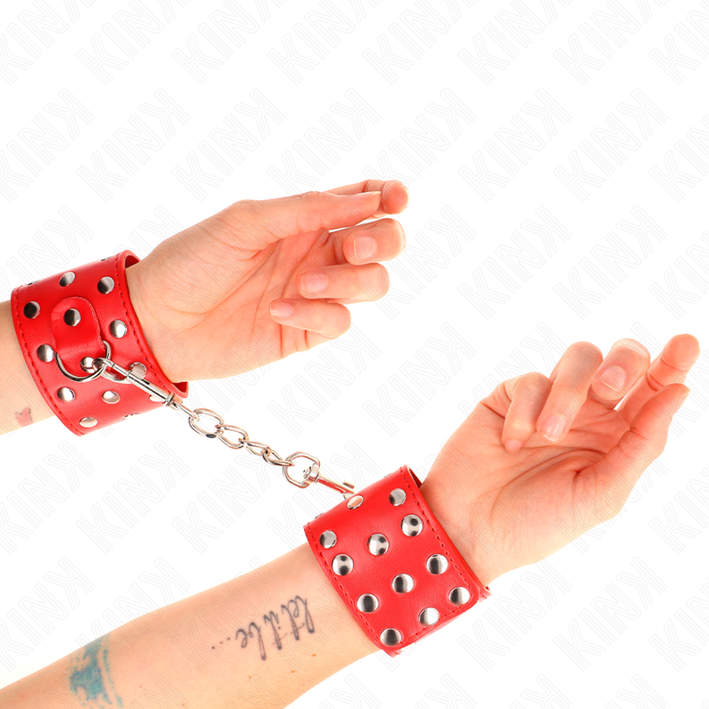 KINK – Handgelenksfesseln mit Druckverschluss, voller Nieten, 19–24 cm x 5,5 cm